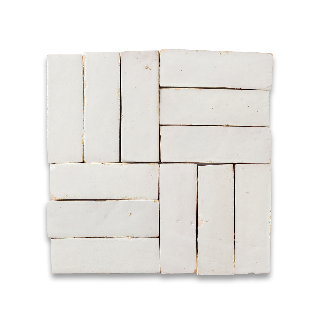 White rectangular tiles arranged in a herringbone pattern on a white background