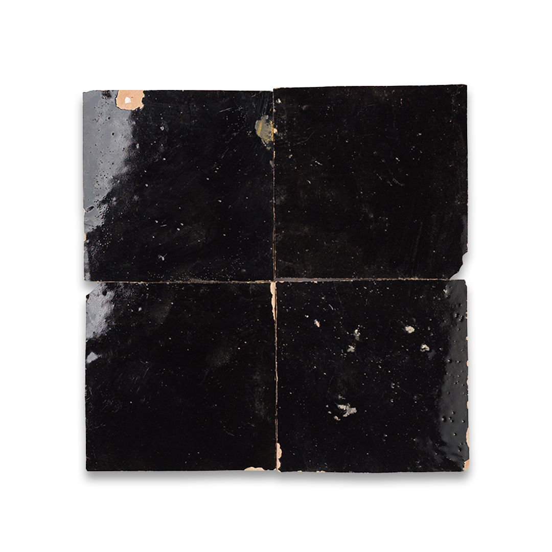 Black square tiles with a glossy finish on a white background