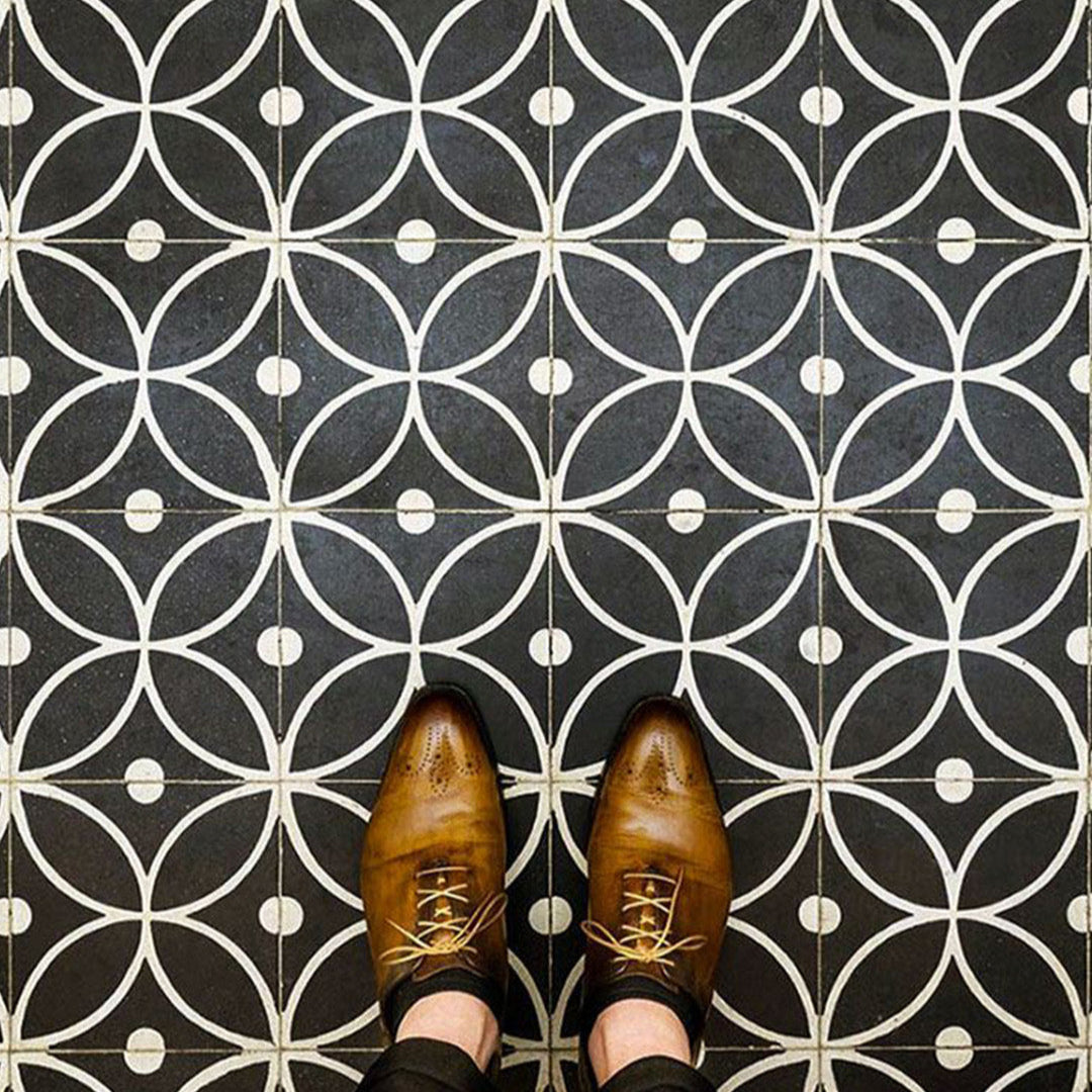 A black and white petal-shaped geometric pattern with circular accents, matte finish, square shape, ideal for modern, vintage, or Mediterranean flooring and wall décor applications.