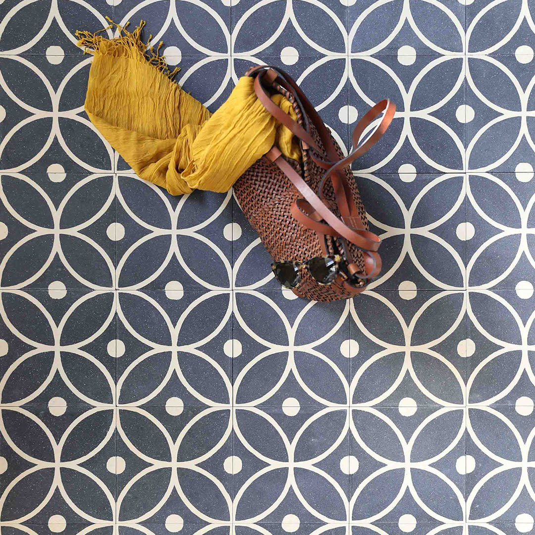 A black and white petal-shaped geometric pattern with circular accents, matte finish, square shape, ideal for modern, vintage, or Mediterranean flooring and wall décor applications.