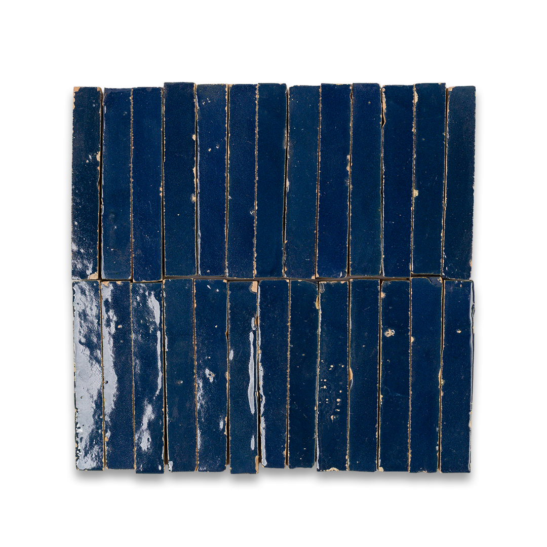 Rectangular tile with blue and white pattern on a white background