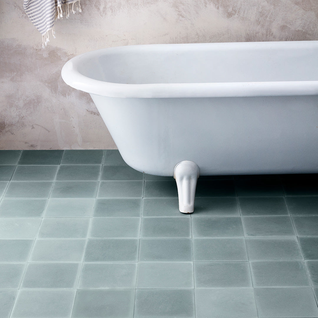 Cement tile featuring a solid muted teal blue color with a smooth matte finish, ideal for minimalist, modern, or contemporary interior flooring, wall cladding, and decorative design applications.