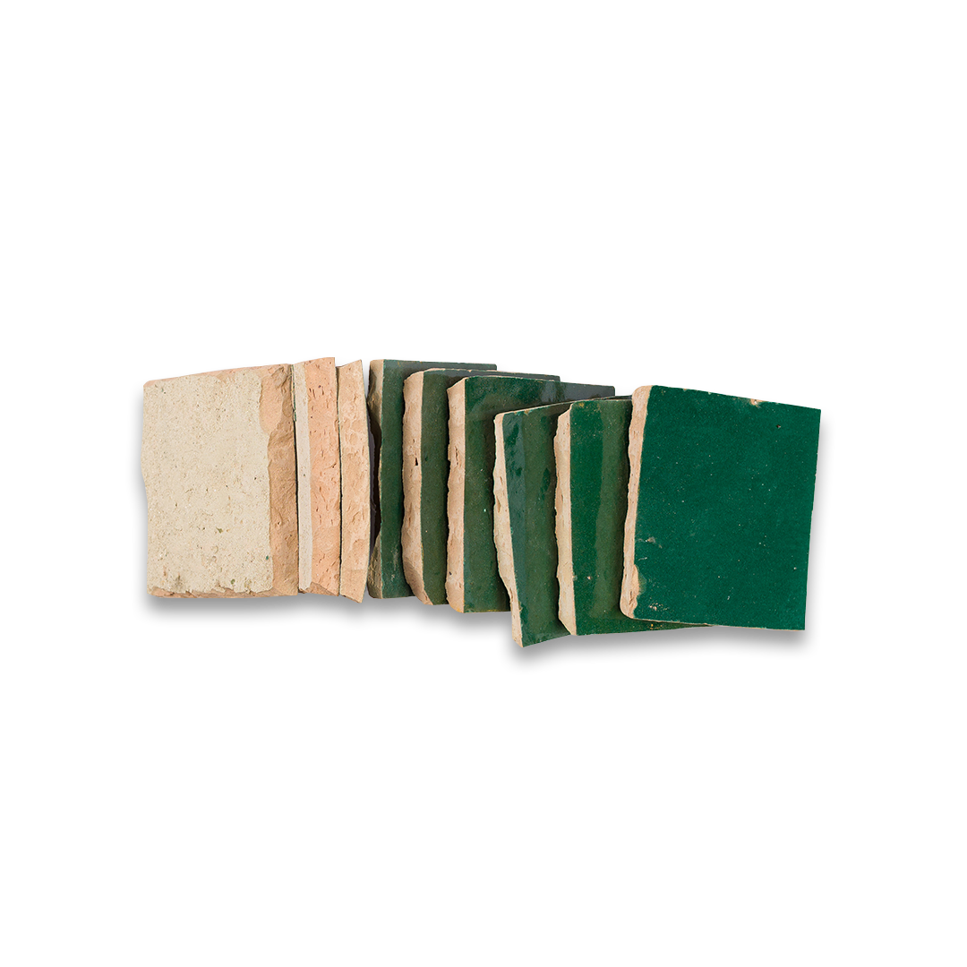 Set of green and beige sandpaper sheets on a white background