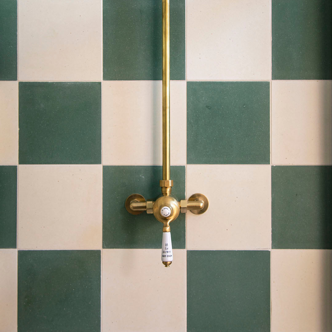 Dirty white cement tile with subtle beige undertones and a rustic matte texture, offering a natural, weathered look perfect for vintage, industrial, or earthy interior designs.