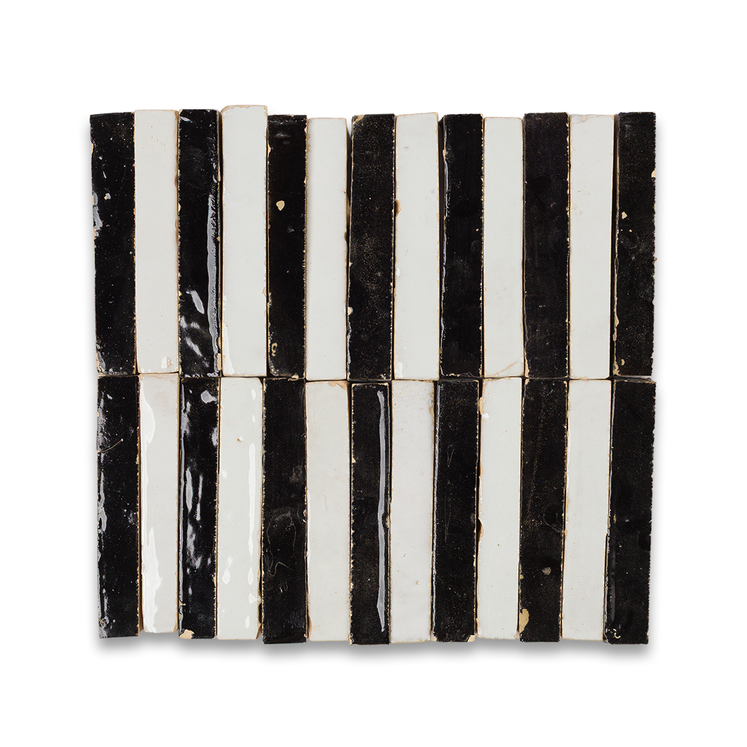Black and white striped ceramic tile on a white background