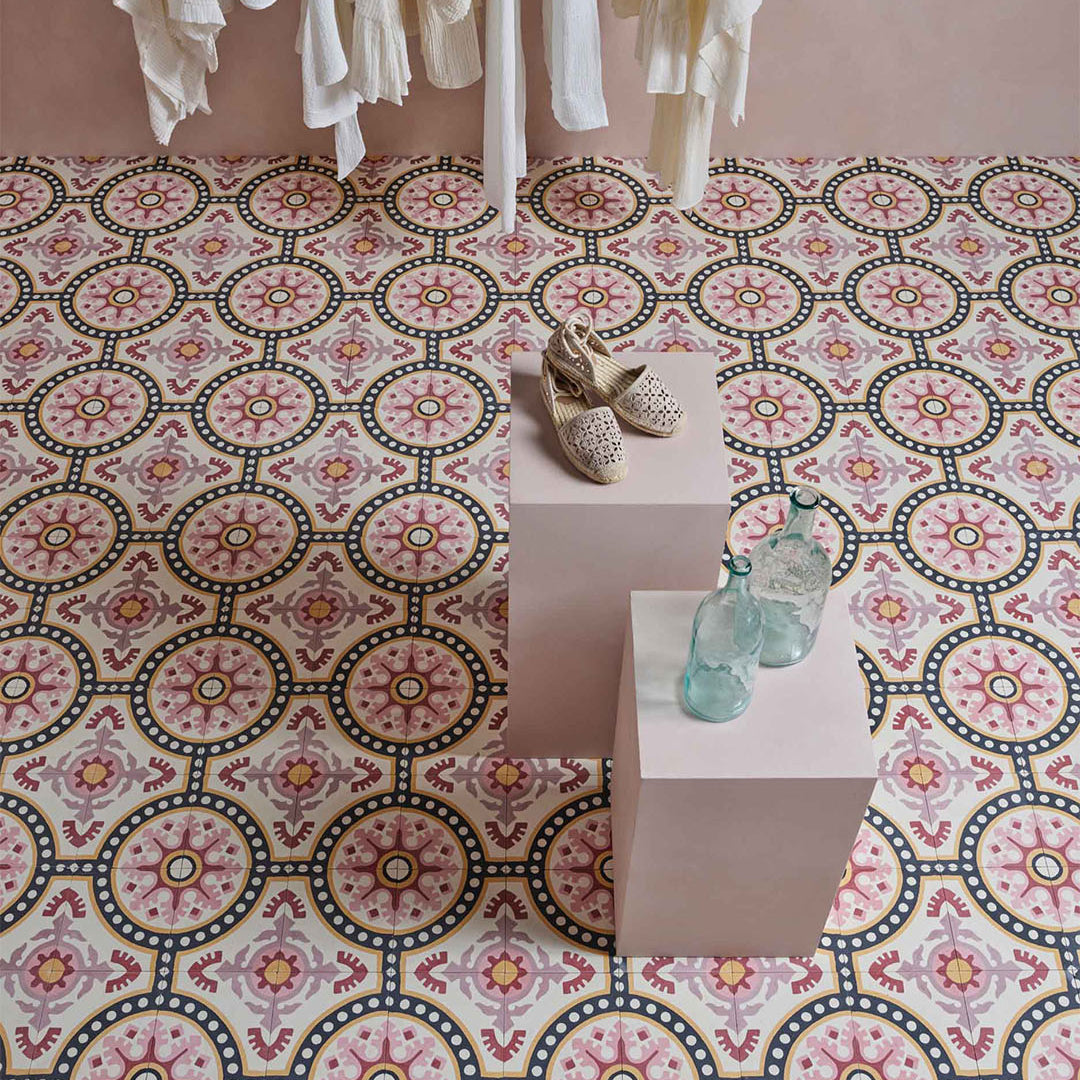 Cement tile featuring an ornate floral and circular motif in dusty pink, terracotta red, mustard yellow, and black accents, matte finish, ideal for Mediterranean, vintage, or eclectic interior flooring and wall décor applications.