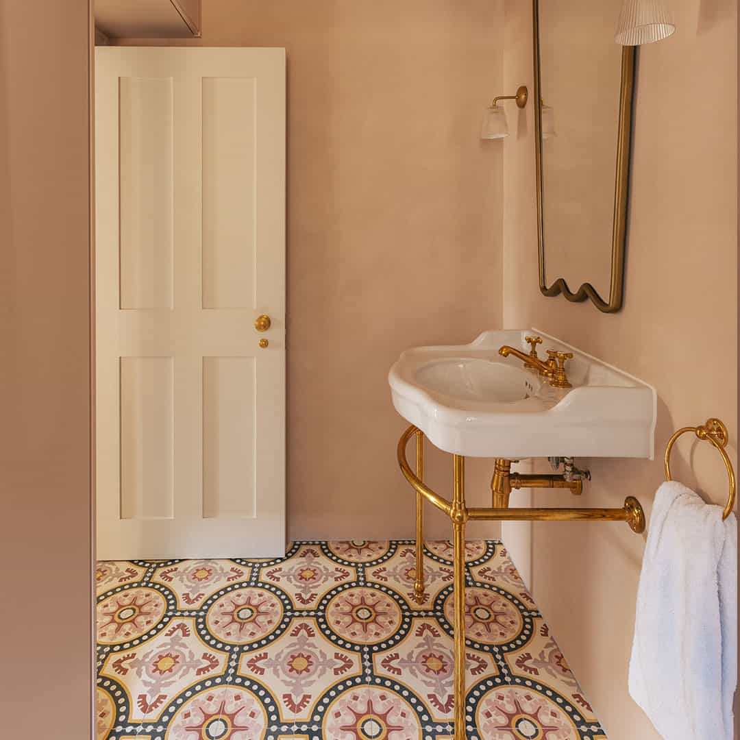 Cement tile featuring an ornate floral and circular motif in dusty pink, terracotta red, mustard yellow, and black accents, matte finish, ideal for Mediterranean, vintage, or eclectic interior flooring and wall décor applications.