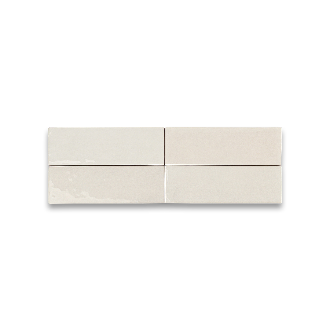Four beige ceramic tiles on a white background