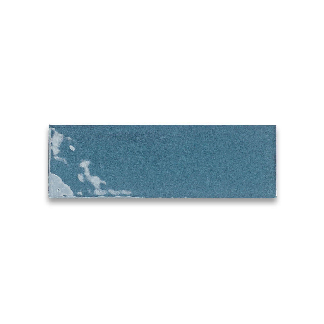 Rectangular blue tile with white marbling on a white background