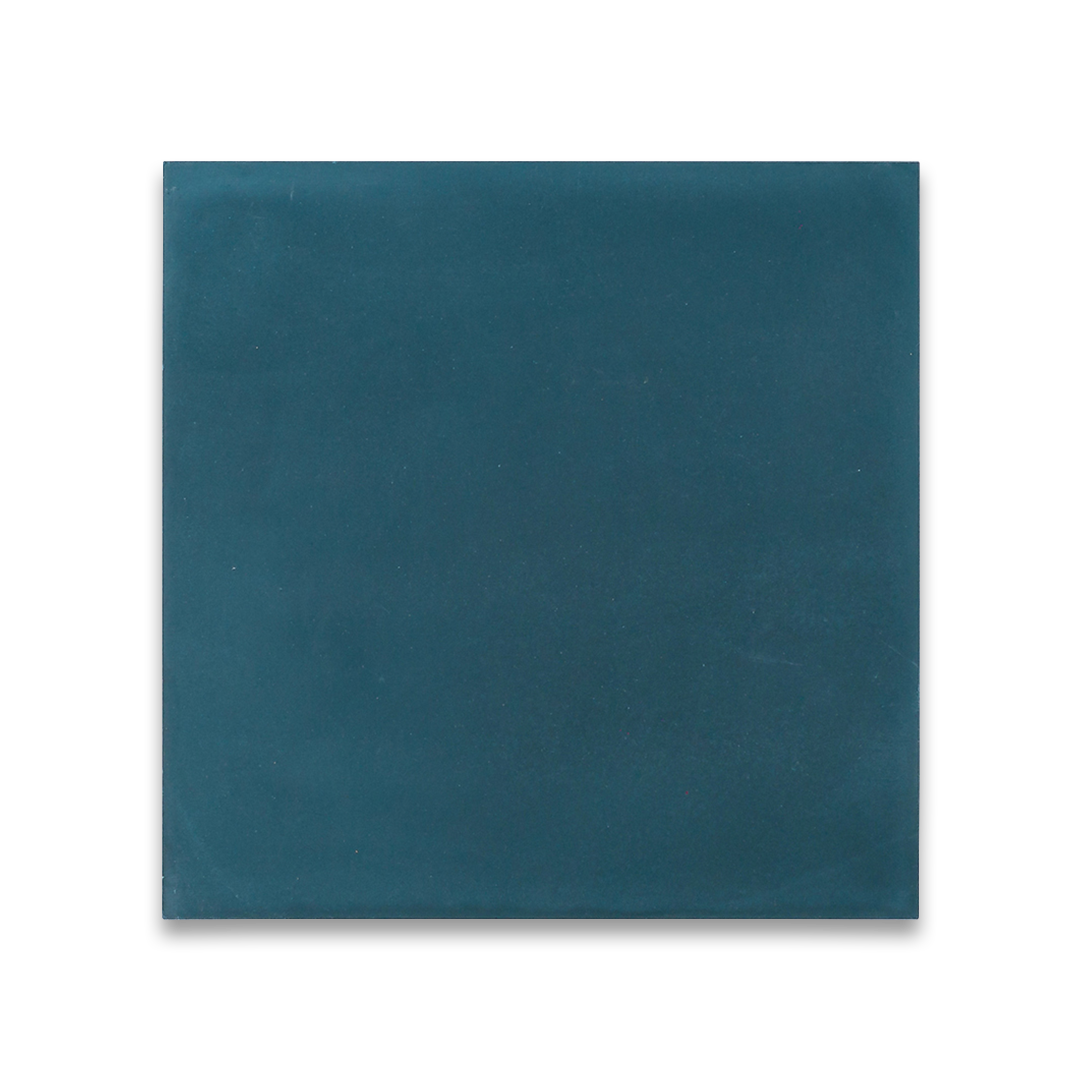 Cement tile featuring a solid deep teal blue color with a smooth matte finish, handcrafted surface, ideal for modern, coastal, or Mediterranean interior flooring and wall décor applications.