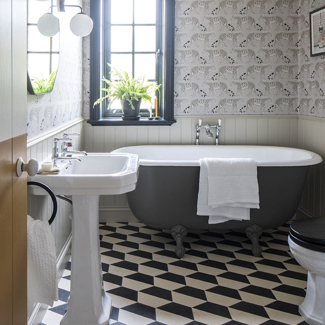 Geometric hexagonal tile featuring a bold black upper section and soft cream lower half, ideal for modern interiors, 3D wall illusions, or contemporary floor patterns.
