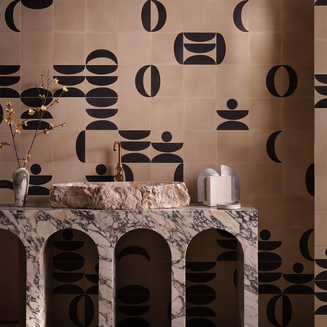 Beige and black geometric cement tile featuring bold curved and circular patterns, minimalist modern design, matte finish, ideal for contemporary flooring, wall décor, and architectural interior applications.