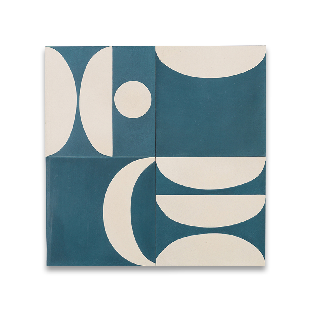 Cement tile featuring abstract geometric shapes in deep teal blue and white, with curved and circular patterns, matte finish, ideal for modern, retro, or mid-century interior flooring and wall décor applications.