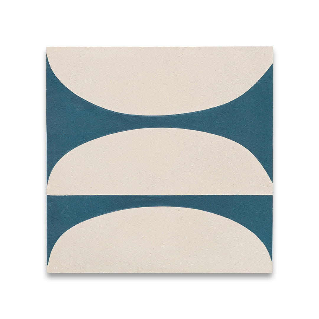 Cement tile featuring abstract geometric shapes in deep teal blue and white, with curved and circular patterns, matte finish, ideal for modern, retro, or mid-century interior flooring and wall décor applications.
