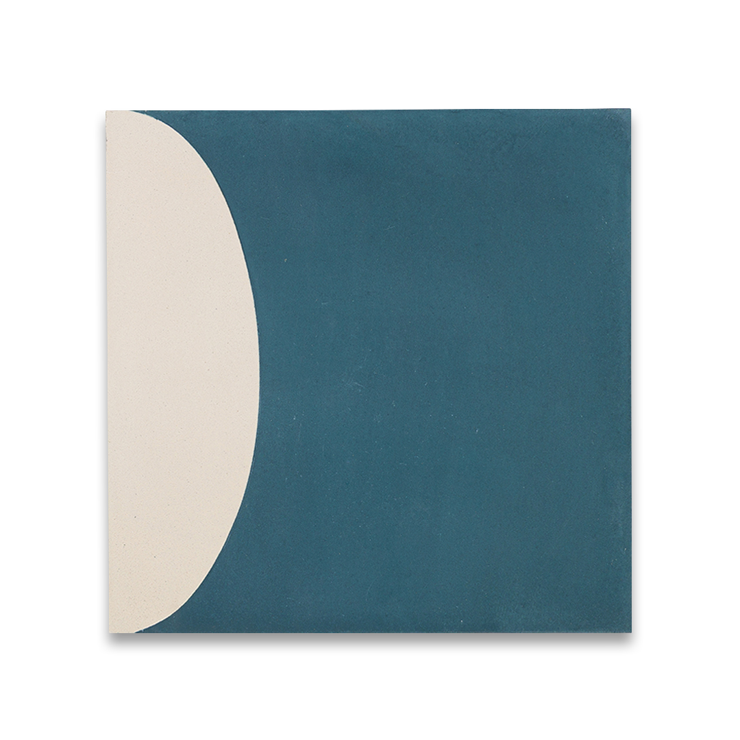 Cement tile featuring abstract geometric shapes in deep teal blue and white, with curved and circular patterns, matte finish, ideal for modern, retro, or mid-century interior flooring and wall décor applications.