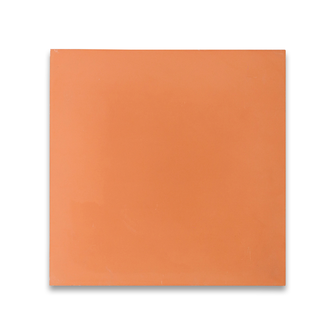 Cement tile featuring a solid peach color with a smooth matte finish, handcrafted texture, ideal for Mediterranean, tropical, or contemporary interior flooring and wall décor applications.