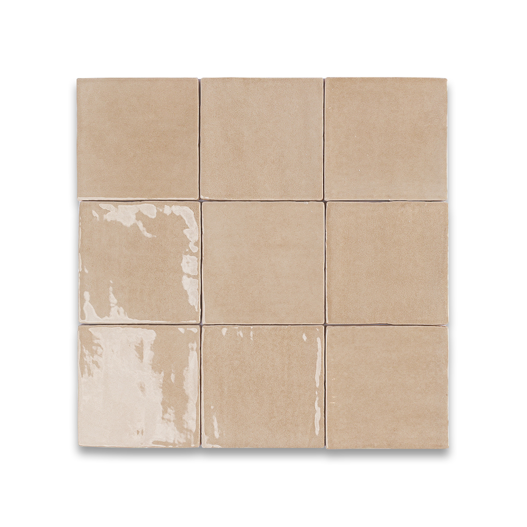 Nine beige tiles with a distressed finish on a white background