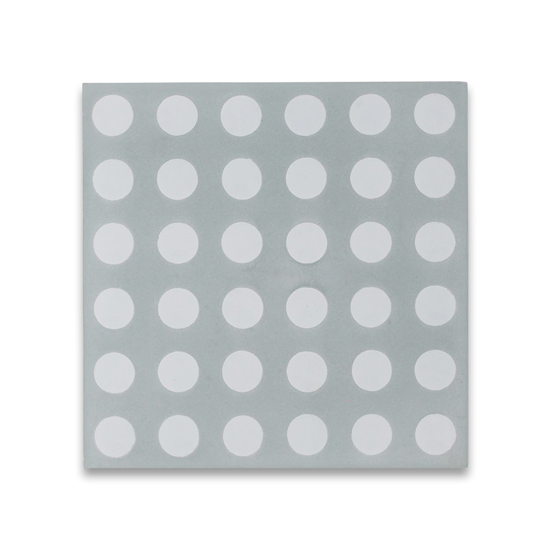 Cement tile featuring a light gray background with evenly spaced white polka dots, matte finish, ideal for retro, playful, or contemporary interior flooring and wall décor applications.