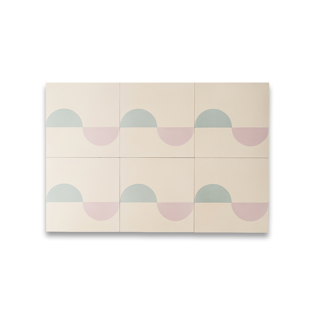 Surfside cement tiles featuring alternating pastel blue and blush pink semicircles on a cream background, forming a continuous wave-like geometric pattern ideal for modern coastal interiors.