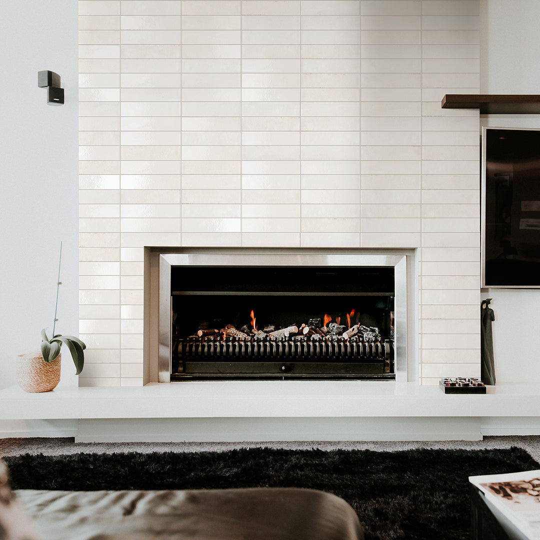Glossy white ceramic bathroom tiles with subtle speckled texture, perfect for modern flooring, backsplash, or shower walls